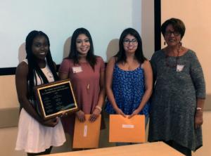 Dr. Yolanda García presents the Yolanda García Award for outstanding community service and social justice for the 2014-2015 school year to Olubukayo Akinyemi, Diana Cervantes, and Yaqueline Rodas. Each award grants $1,000.